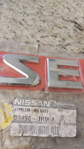 Emblema Traseiro Se Nissan Frontier 2007-2012 93496jr90a Prateado - Imagem 2